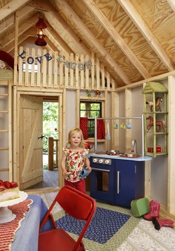 A nifty Kid Cave with cute kitchen and matching throw rugs. Source: Built By Kids